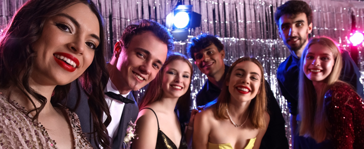 a group of people take a selfie at a party